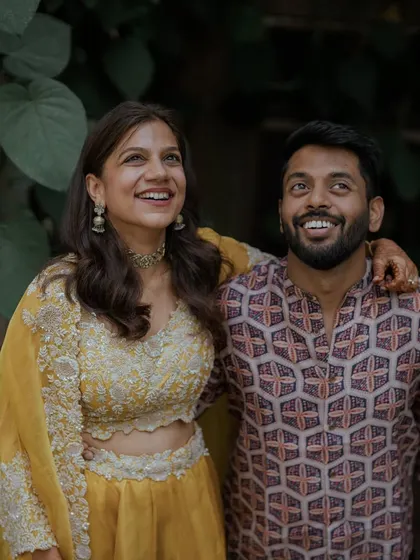 A joyful, upward-looking shot of the couple.