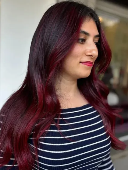 A side profile of the client, her red highlights framing her face beautifully.