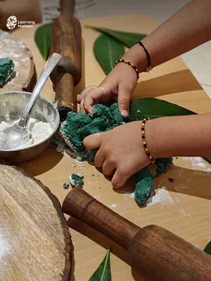 This image captures the focused effort of a child engaged in playdough exploration. This kind of hands-on play not only builds physical skills but also calms the mind and encourages creativity.