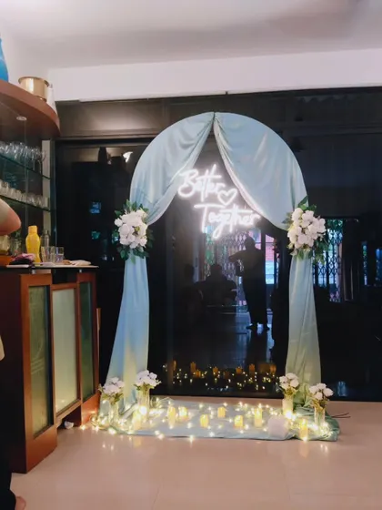 A wider view of the 'Better Together' neon sign setup, showing how it transforms a home's entrance into a special photo point. This kind of decor is perfect for welcoming guests to an engagement party or roka ceremony.