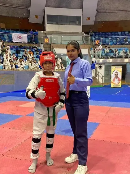 One of my students with the referee at the Open National Taekwondo Championship 2023.