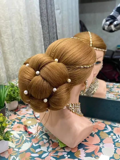 A side view of the 3D braided bun, showing the clean parting and the height at the crown. These foundational skills are crucial for creating professional-level work.
