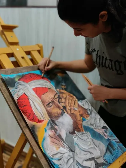 A candid shot of me deeply focused on the portrait. Creating art like this requires complete concentration to get every detail just right.