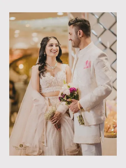A beautiful portrait of the couple after their engagement. The bride holds a bouquet, and they share a happy, loving look.