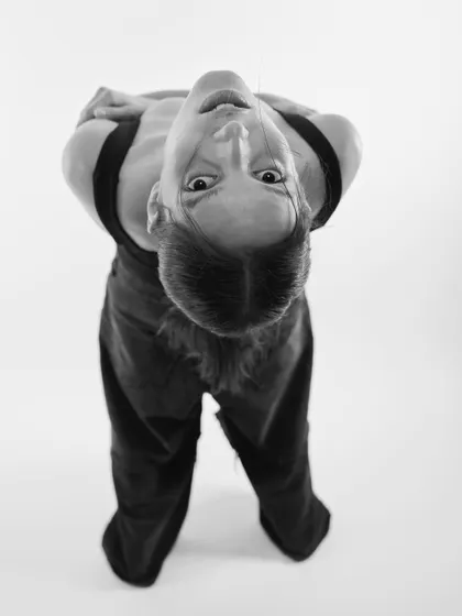 An inverted, disorienting portrait in black and white. This unconventional angle creates a surreal and intriguing image.