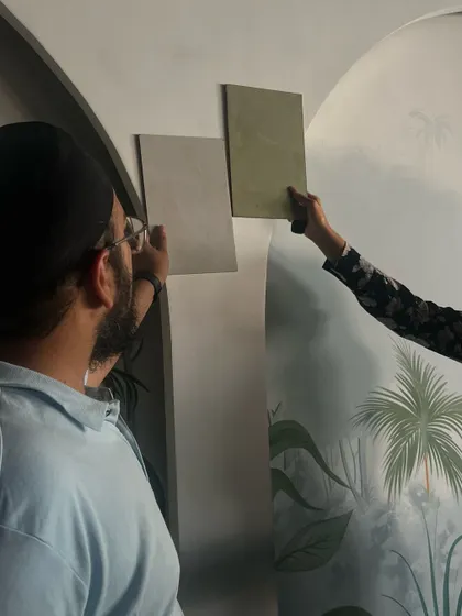 A close-up of our team selecting finishes against the backdrop of the mural.