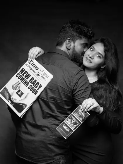 A fun and creative pregnancy announcement shot in the studio, using a custom newspaper prop and ultrasound scans.