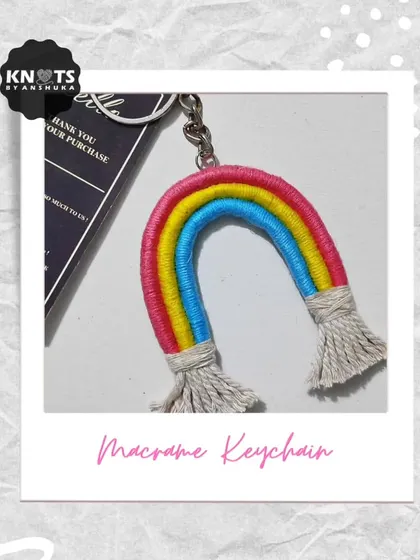 My macrame version of a rainbow keychain, made by wrapping colorful yarn around cotton rope and adding fluffy tassels at the ends.