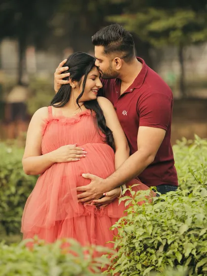 A sweet and intimate moment from a maternity shoot. Our rental gown helps make these precious memories even more beautiful.