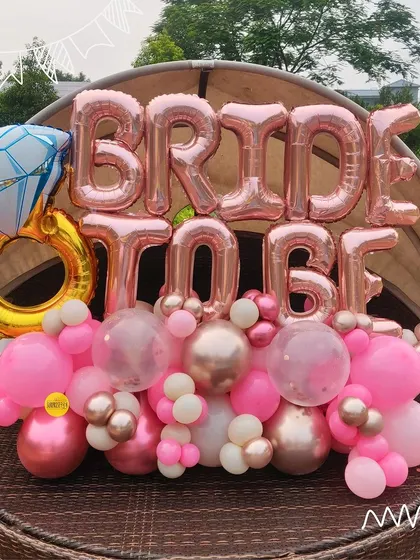 A fun and feminine "Bride to Be" balloon arrangement, perfect for decorating a bachelorette party or as a gift for the bride.
