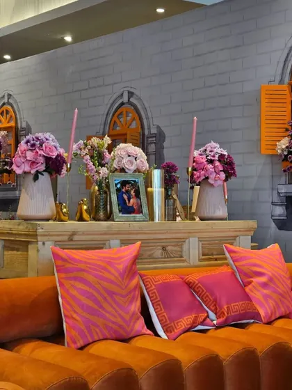 Another view of the lounge area, showing how personal photos were integrated into the decor. These thoughtful touches help to tell the couple's story and make the celebration feel deeply personal.
