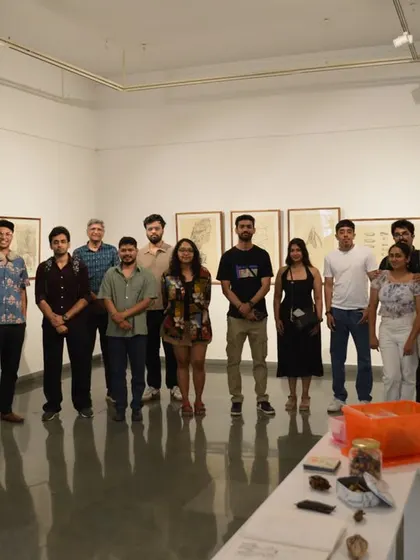 A group photo of visitors and the artist at the 'Bring me Flowers' exhibition.