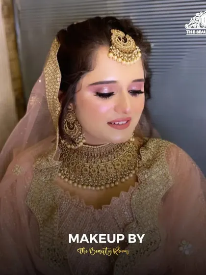 A close-up of the makeup, highlighting the soft pink and gold tones on the eyes and the radiant finish on the skin.
