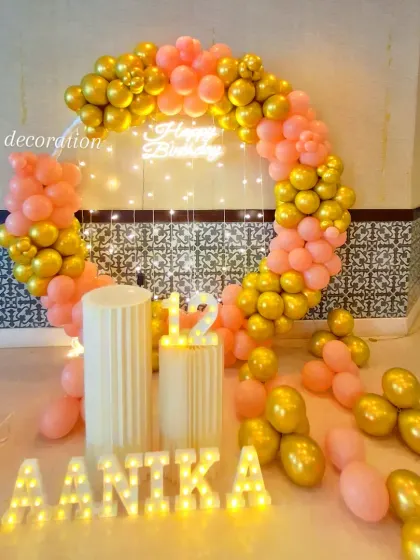 A different angle of the 12th birthday setup, showing the shimmer of the metallic gold balloons.