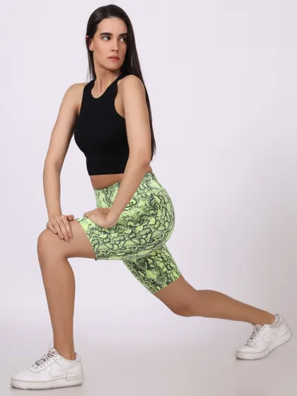 A model in a lunging pose, demonstrating the flexibility and fit of the activewear during a workout.