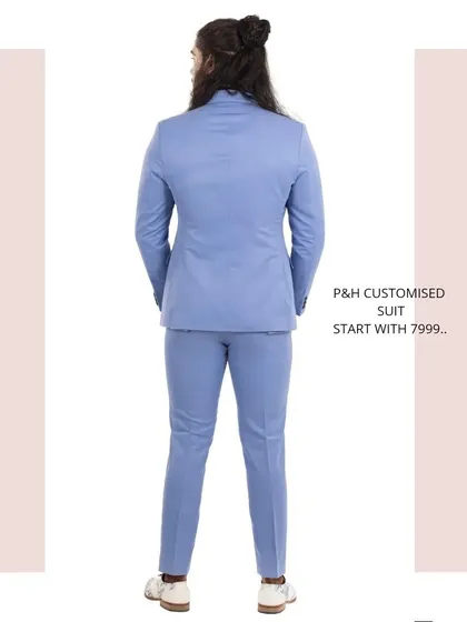 The back view of the sky blue suit, demonstrating the clean lines and precise fit.