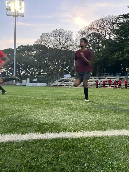 Close-up action of our players during a high-intensity running drill at dusk.