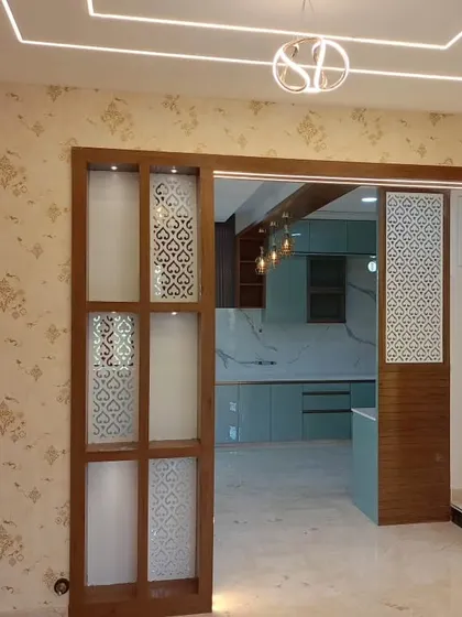 A light damask wallpaper installed in a hallway with modern wooden and glass partitions.