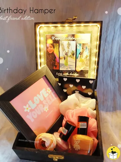 The Best Friend Edition hamper, all lit up. The warm glow from the lights makes the photos and gifts inside look even more special.