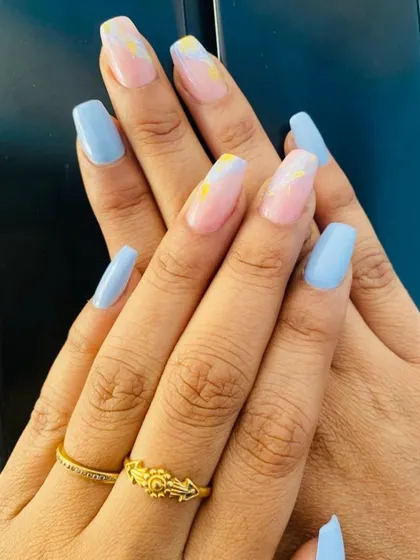 A closer view of the pastel marble art with hints of yellow and pink on a sheer base. This design is perfect for adding a pop of color in a soft, elegant way.