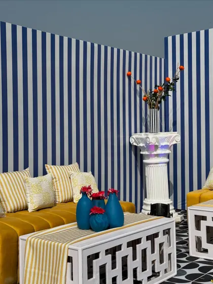 From concept to execution in just 42 hours. This St. Tropez inspired decor in Ahmedabad involved transforming a bungalow with custom-painted walls, fruit-based installations, and unique props, all on a tight deadline.