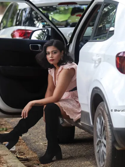 Using a car as a prop for a modern, stylish outdoor portrait. It adds a narrative element to the lifestyle shoot.