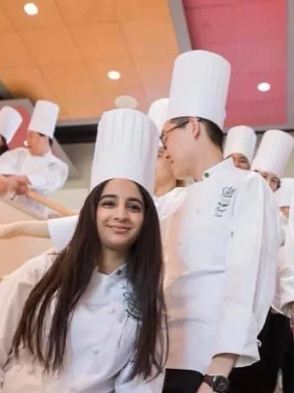A photo from my time as a student, wearing the classic chef's toque. It's a reminder of where it all started.