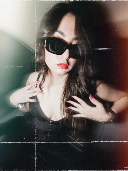 A close-up shot from the vintage car series, focusing on the bold red lip and sunglasses.
