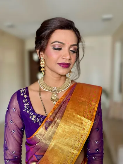 A close-up of the eye makeup, featuring a soft shimmer and a defined lash line. This look is inspired by the rich traditions of South India but with a modern, soft touch.