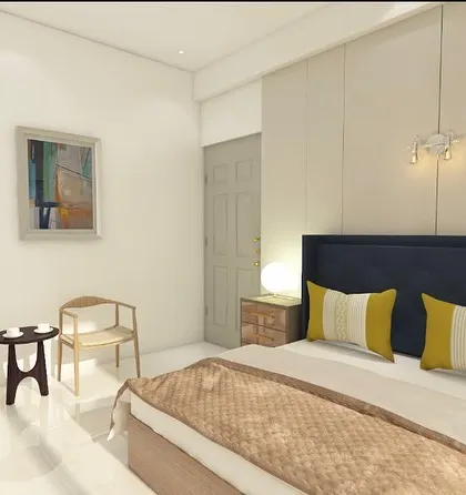 A seating corner in the bedroom with simple, Scandinavian-style chairs. This provides a space for conversation or a quiet moment away from the main living area.