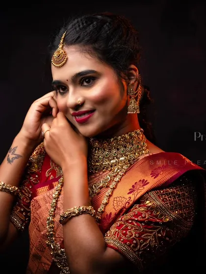 A close-up showing the beautiful jhumkas and bangles that are part of our complete bridal jewellery rental sets.
