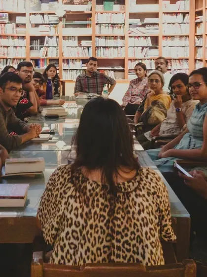 A group of people gathered in our cozy bookstore area for a discussion circle.