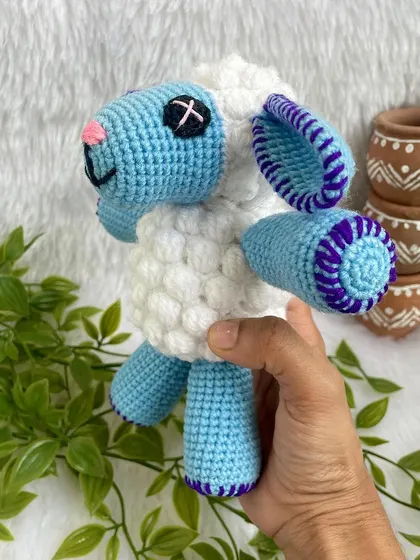 This cute blue sheep is from the popular kids' show Cocomelon. The bobble stitch gives it a fluffy texture, and the bright colors make it a perfect toy for little ones.
