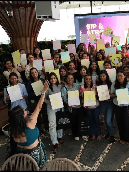 The team from Meesho proudly holding up their finished texture paintings. It was an amazing experience to see so many people, most of whom had never painted before, create such beautiful and personal artworks.