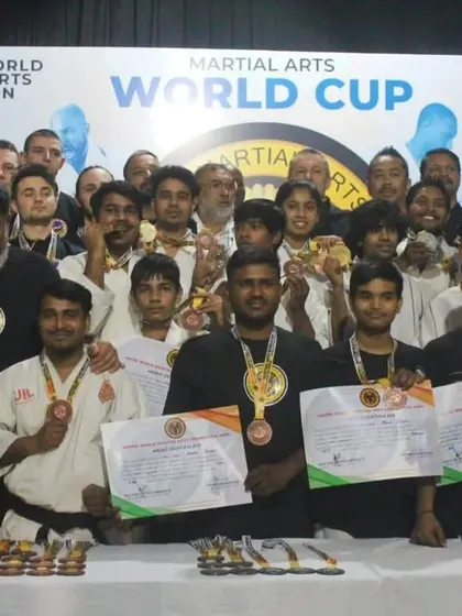 A group photo with all the winners and masters at the UWMAF Martial Arts World Cup. A proud moment for team India.