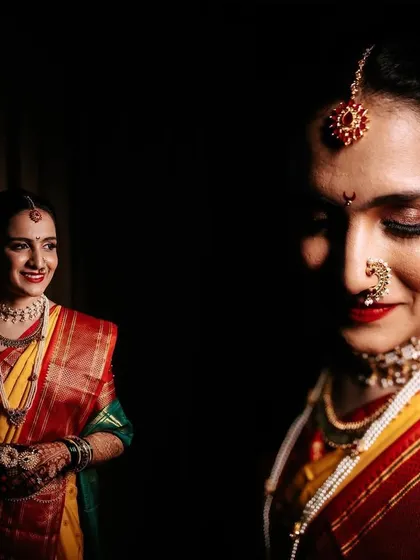 A diptych of bridal portraits with dramatic lighting. One shot is a wider view of her smiling, while the other is a serene close-up, both set against a dark background.