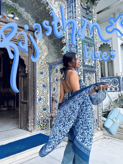Rajasthan Blues. The text itself is part of the art, with a 3D effect that makes it pop against the stunning blue architecture.