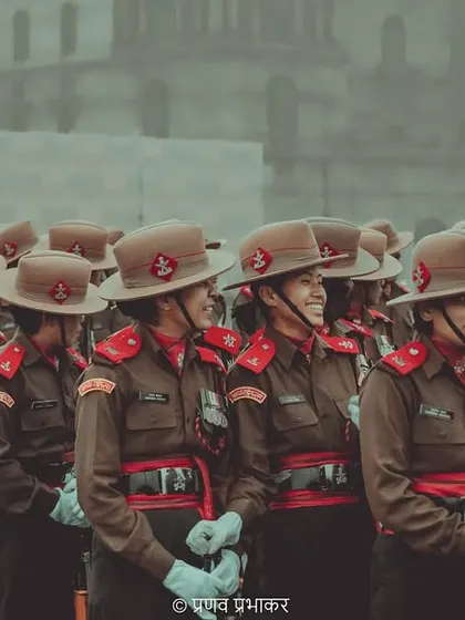 A candid moment of camaraderie among the women of the Assam Rifles contingent during the parade rehearsal. Even in uniform, their individual personalities shine through.