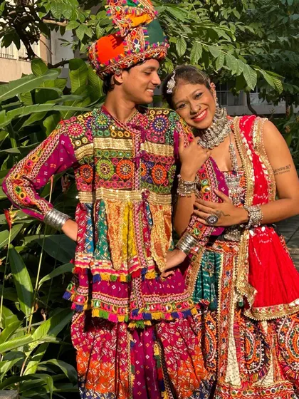A happy moment captured between a couple wearing my rental outfits. Notice the detailed silver jewelry on her and the intricate embroidery on his tunic.