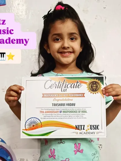 Takshavi, one of the youngest participants in our 2025 Independence Day competition, proudly holds her certificate. She won the 'Best Performance' award for her rendition of 'Nanha Munna Rahi Hoon'.