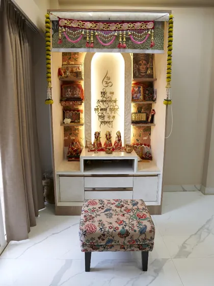 A full view of the pooja unit, showing the ample shelving for deities and the elegant design that makes it a divine focal point in the home.