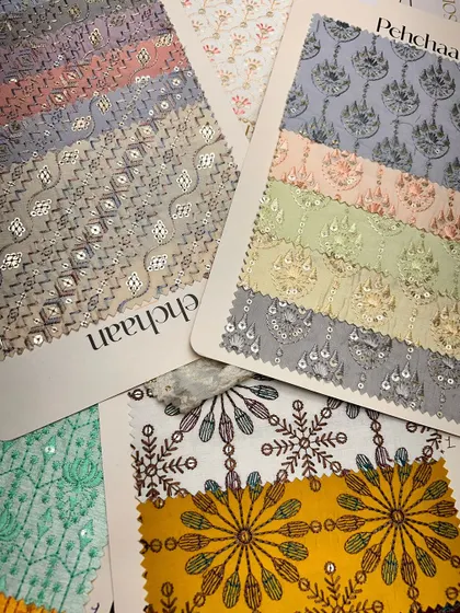 A vibrant collection of embroidered and patterned fabrics from our 'Pehchaan' collection, perfect for creating unique traditional wear.