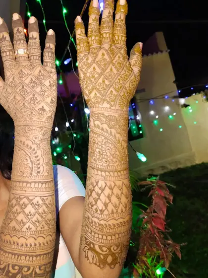 Another view of the beautiful dark stain, this time with festive lights in the background, capturing the wedding mood.
