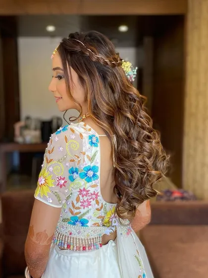 A fresh and vibrant look for a summer wedding event. Gunjan's makeup features a bright hue on the eyes and effortless nude lips.