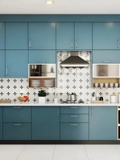 In this design, I used a sophisticated matte teal for the cabinetry, creating a calm and modern atmosphere. The layout includes clever storage solutions like open wicker baskets, adding a touch of rustic texture to the contemporary color scheme.