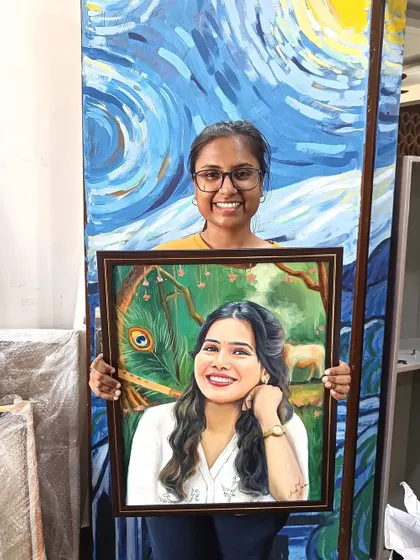 Me holding the finished Krishna-themed portrait in front of my studio's "Starry Night" wall.