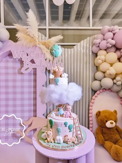The centerpiece of the "We Can Bearly Wait" baby shower was this incredible cake, perfectly matching the theme with teddy bears, clouds, and hot air balloons.