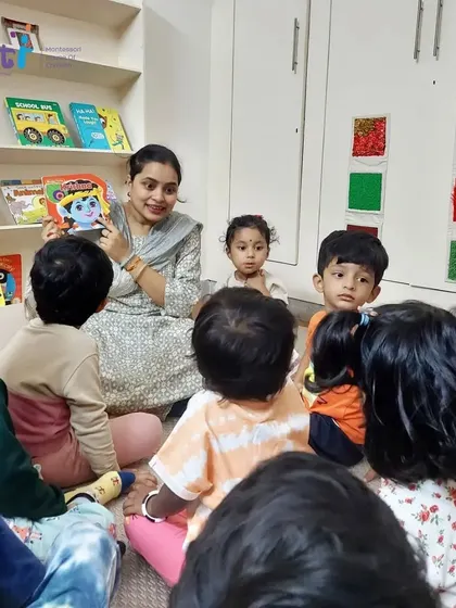 Our toddlers listen with wide-eyed wonder to a story about baby Krishna. We use age-appropriate books and language to make festivals meaningful for our youngest children.