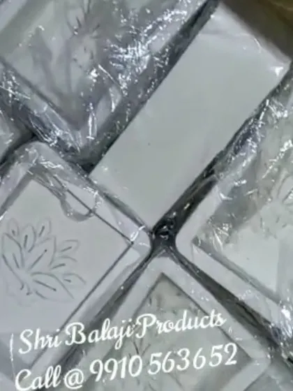 Your order, ready to go! This shows a batch of custom-made silicone molds with a lotus design, all packaged and ready to be shipped to another creator starting their brand journey.