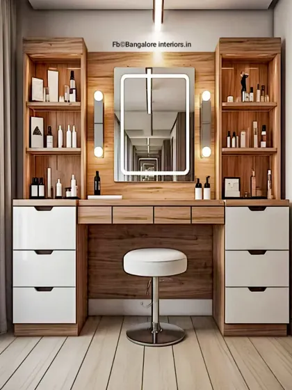 A complete and luxurious dressing table unit. It features two towers of drawers and shelves for makeup and accessories, centered around a large, professionally lit mirror.